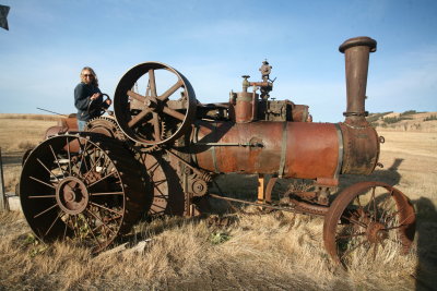 My wife  Patty  On Vintage Case Steam Tractor
