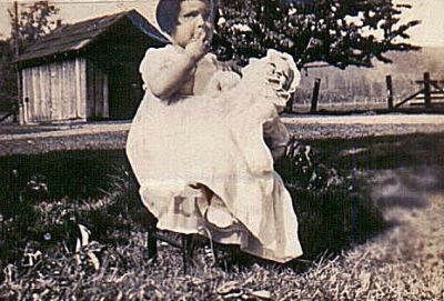  Mom ( Jann )  1940 with doll in town of Riffe