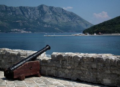 Budva City walls and canon towards St Nikolas island