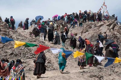 With ceremonies over, ordinary worshippers climb up the hill to the newly-consecrated shrine