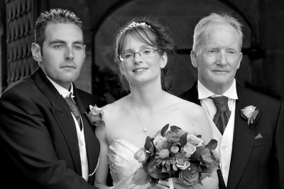 The Bride and Groom with the Bride's Dad in Black and White