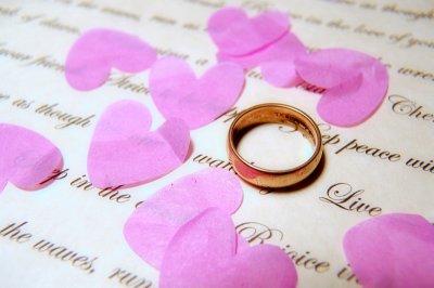 Gold Wedding Ring and Confetti