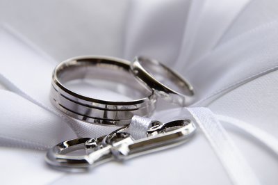 Silver Wedding Rings on White Ring Cushion