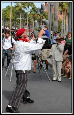 Street performer juggling cups