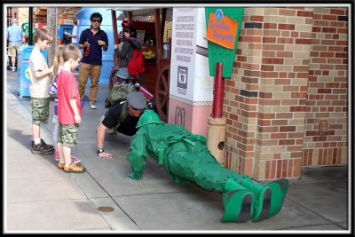The Toy Story Army soldier challenges a nearby father to a push up competition :-)