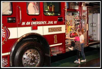 Playing on the fire truck at Innoventions