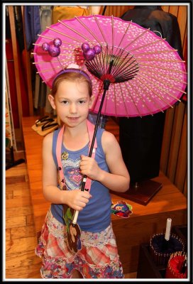 Noelle tries out an umbrella in Japan