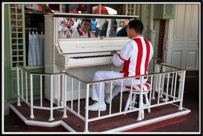 Piano player outside the barber shop!