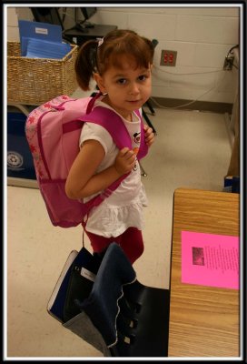 Kylie finds her assigned seat in her classroom