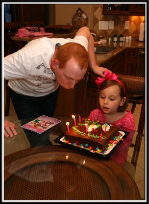 Brett's birthday was 3 days before Kylie's, so they shared a birthday cake and blew out the candles together