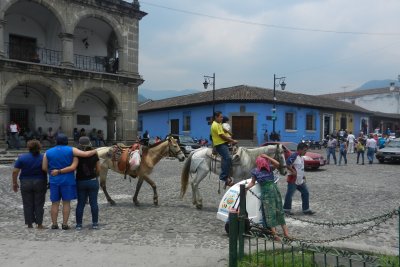 People enjoying a ride on a horse