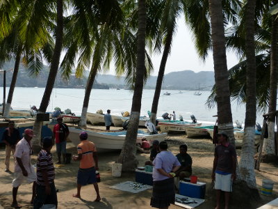 Daily fishing life goes on, even with thousands of tourists descending on the village
