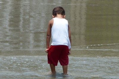 A local younster plays in the water