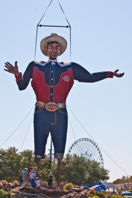 Big Tex with the Texas Star ferris wheel in the background.