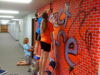Putting up the Graffiti wall in the classroom hallway