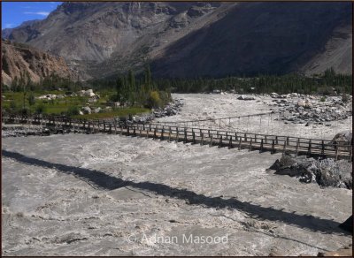 Khushhal Bridge over angry Indus river.jpg