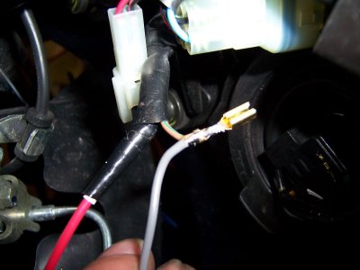Gray wire gets connected to flasher output (brown wire) and red wire from cancel unit goes to the other side of blue wire