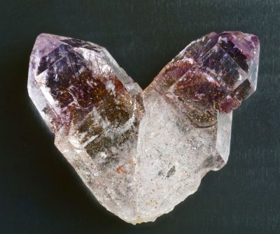 Japan-law twin of amethyst with goethite inclusions, 25 mm. Lac Aloatra, Madagascar.