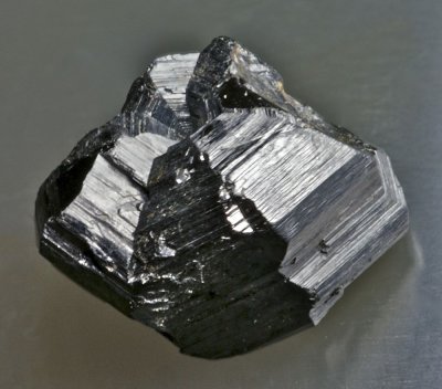 Rutile cyclic eightling twin, 13 mm, Magnet Cove, Arkansas, USA.