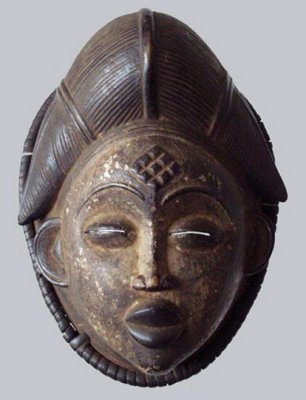 Punu okuyi dance mask with black pigment, 27 cm tall. Ngounié valley, South Gabon.