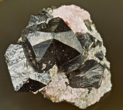 Alabandite spinel twins to 25 mm on rhodochrosite, Ucchuccachua Mine, Peru