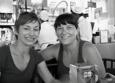 Friends Sharing Coffee and Beignets at Cafe du Monde