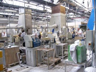 Wide view of glass cutting floor and workbenches