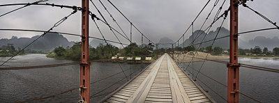 vang vieng, bridge into town, panorama
