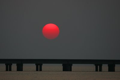 Haze Filtered Sunset Over The 24 Mile Long Lake Pontchartrain Causeway