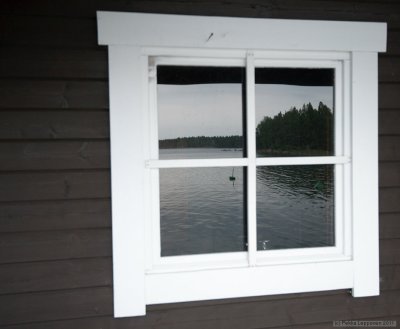 Sauna window reflecting the sea