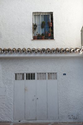 mijas window with flowers and doors