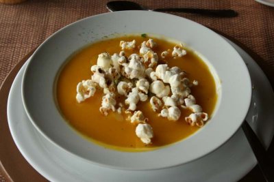 Soup garnished with popcorn - very tasty
