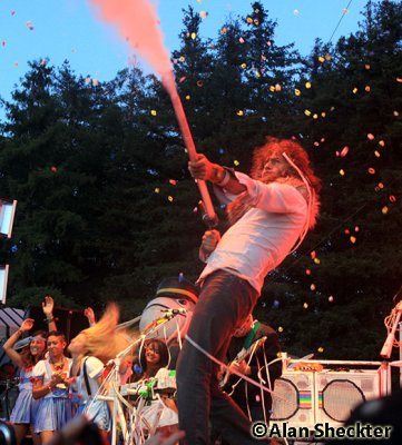 The Flaming Lips' Wayne Coyne fires confetti into the crowd
