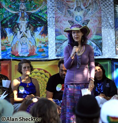 Activist/astrologer/national radio host Carolyn Casey at a panel on Today's Activism: What You Can Do Now on the Wisdom Stage