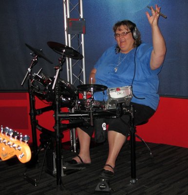 Donna shows off her drumming skills in the Roland Live make-your-own-music section of the Grammy Museum