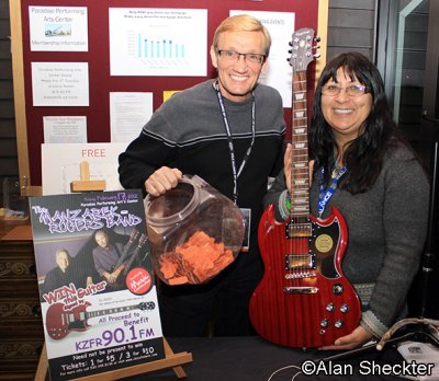 KZFR's Ray and Anna with guitar to be raffled