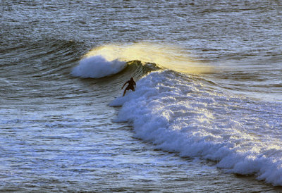 Surfer at Maliko Bay, north shore
