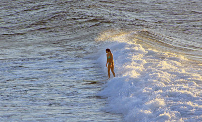 Surfer at Maliko Bay, north shore