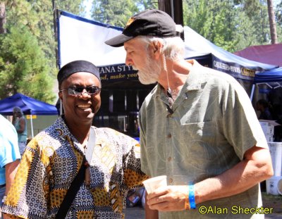 Festival Director Dan DeWayne greets Babá Ken Okulolo