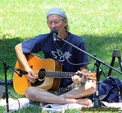 John-Michael Sun leads kirtan session on the Evergreen lawn