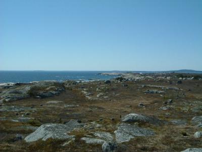 In the distance is the lighthouse at Peggy's Cove; a beautiful, sunny, warm day!!