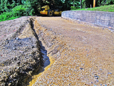 Access road with trench for drain