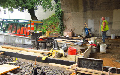 Working area beyond the area for new concrete