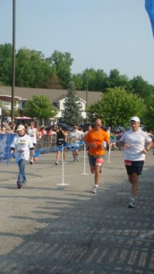 jeff running to the finish line in the geist half