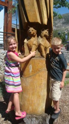 more posing with wooden statues