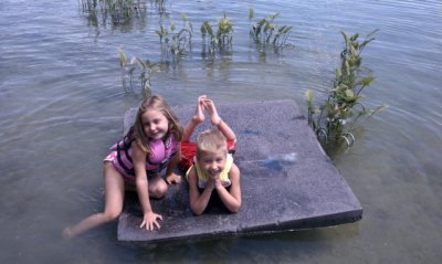 cute kids on a raft