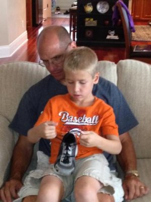 learning to tie shoes- he finally has learned!