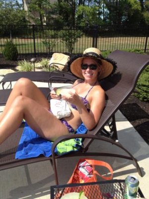 amy catching rays with a margarita and magazine