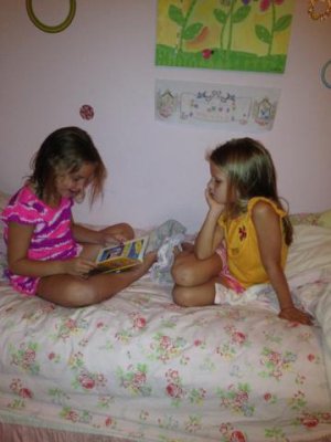 reading to each other during their sleepover