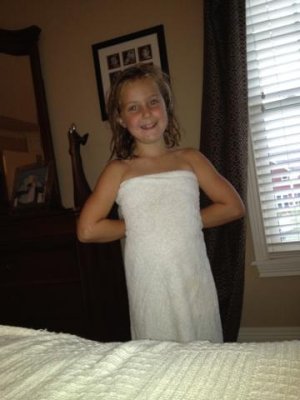 e pretending her towel is a dress